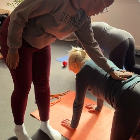 Guided exercise session focusing on posture, core control, and functional movement