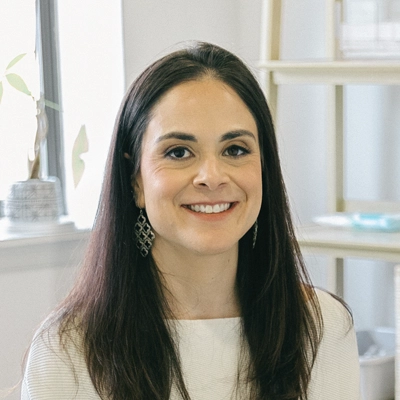 A headshot of Dr. Ali Perez, a chiropractor at Bethesda Chiropractic & Rehabilitation.